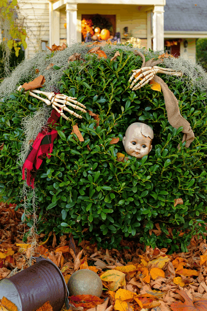 20 Hauntingly Creative Shrub Decorations for a Show-Stopping Halloween Yard 3